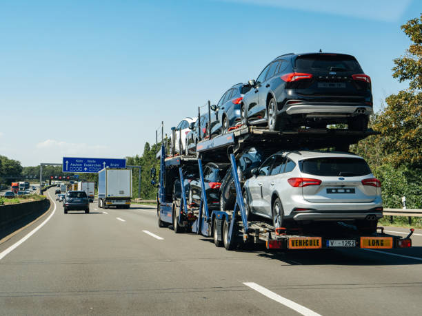 Multi-level car carrier transporting vehicles on highway in Tampa Florida area